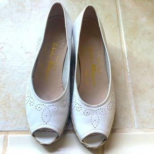 Women’s white Salvatore Ferragamo wedges. White leather in excellent condition.